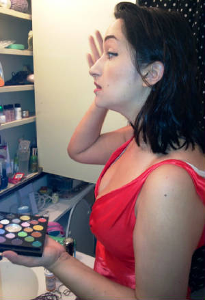 Allegra applying makeup.JPG