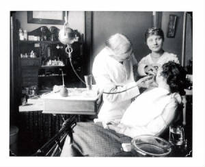 Dentist cleaning girl's teeth.jpg