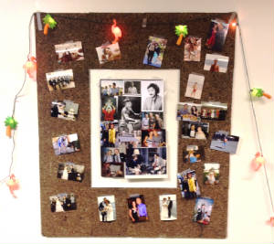 Harlan photos on corkboard.JPG