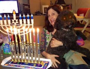 Pattie and Latke with Chanukah menorah.jpg