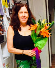 Pattie with flowers on 30th anniversary.JPG