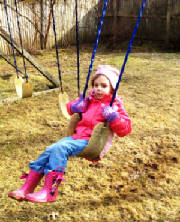 Rosalie swinging.JPG