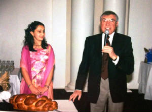 Uncle Gerard chanting the Motzi at Allegra's bat mitzvah.JPG