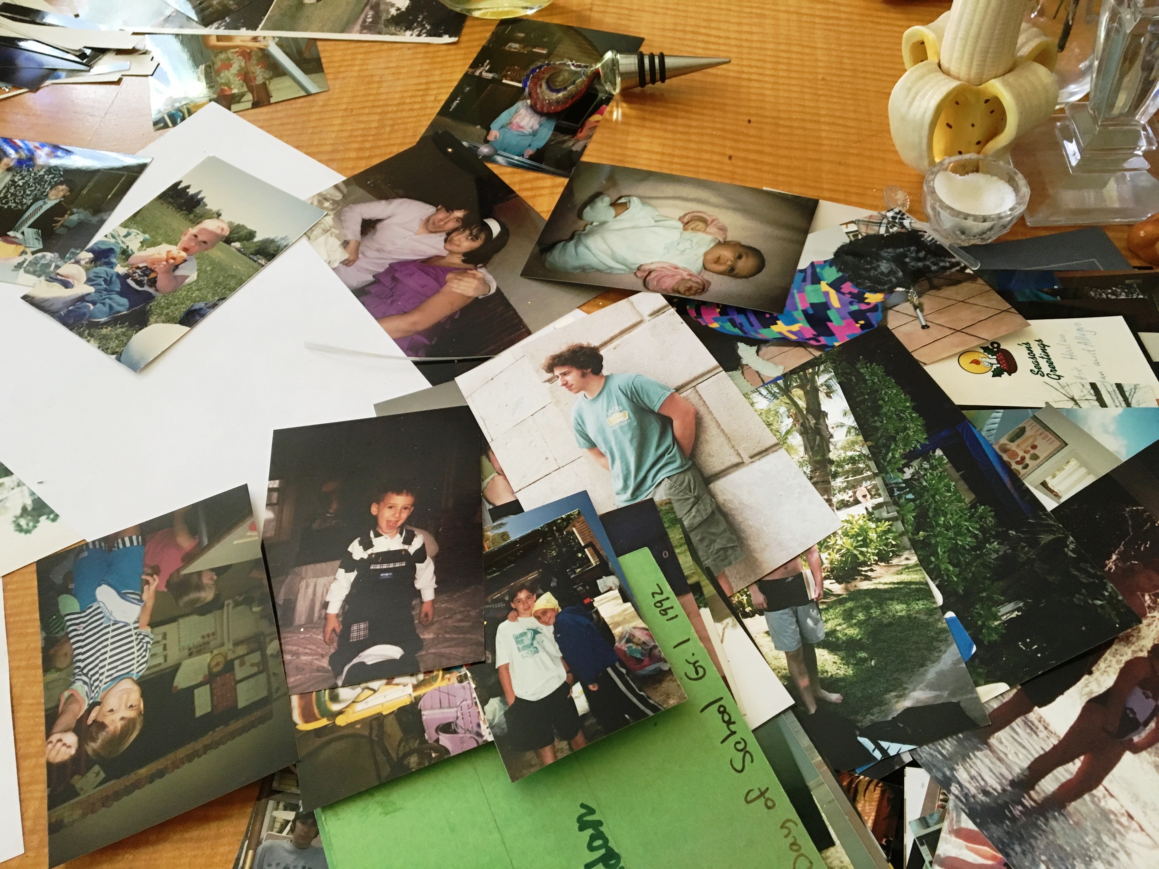 Photos covered the dining room table.JPG