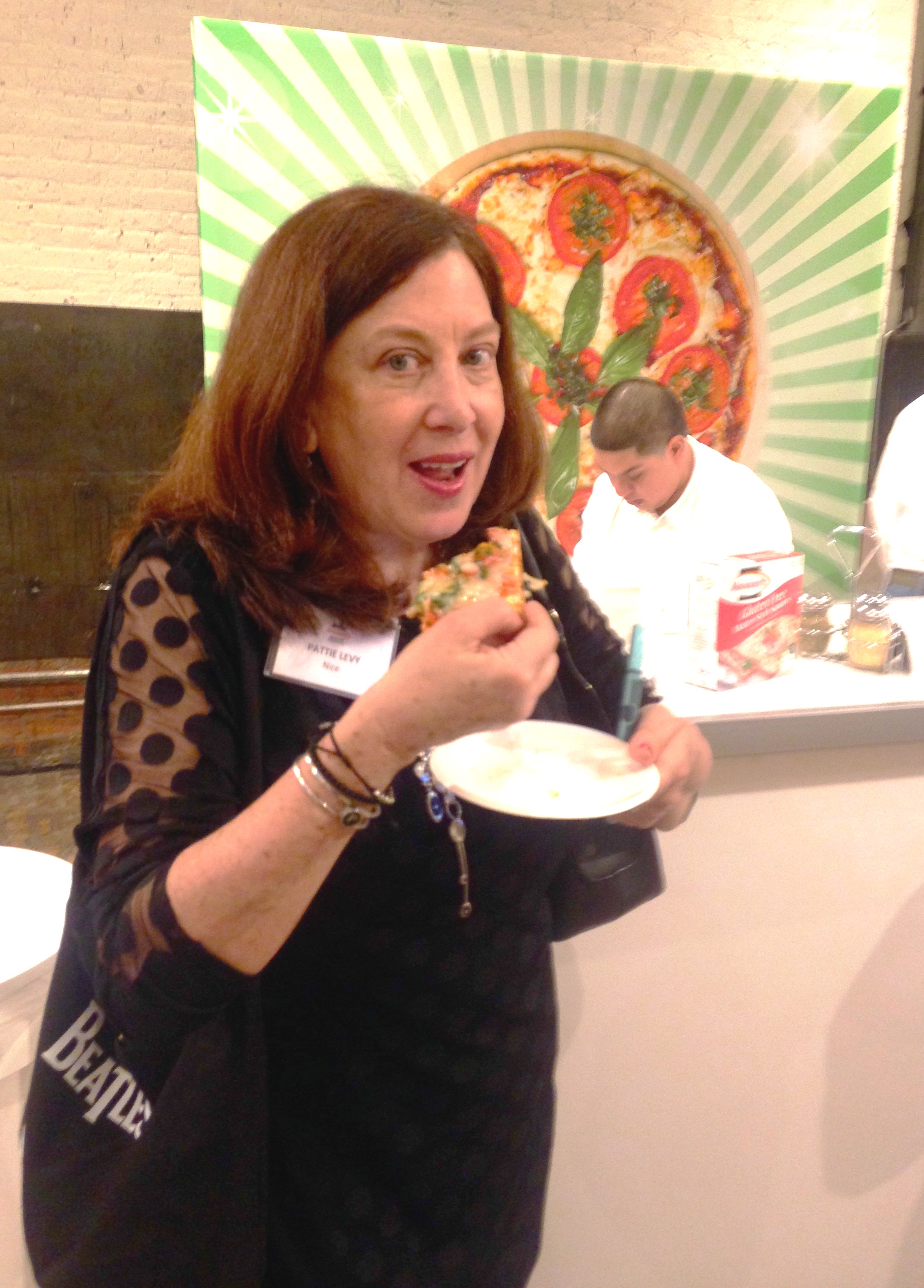 Pattie eating matzo pizza.jpg