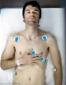 He was lying with electrodes strapped to his bare chest.jpg